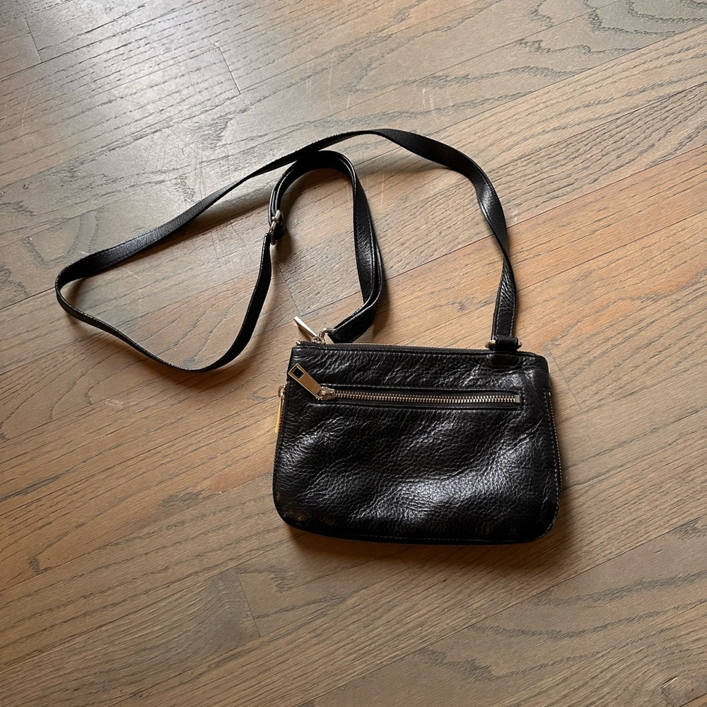 Halogen black and tan expandable mini purse. Leather. Zip close.